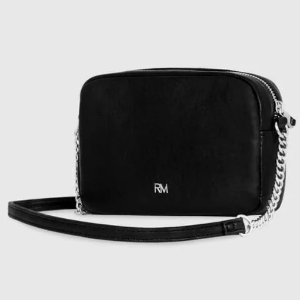 Rebecca Minkoff• Mini quilted studded black crossbody bag. 7.25” x 2.25” x 5.25”
